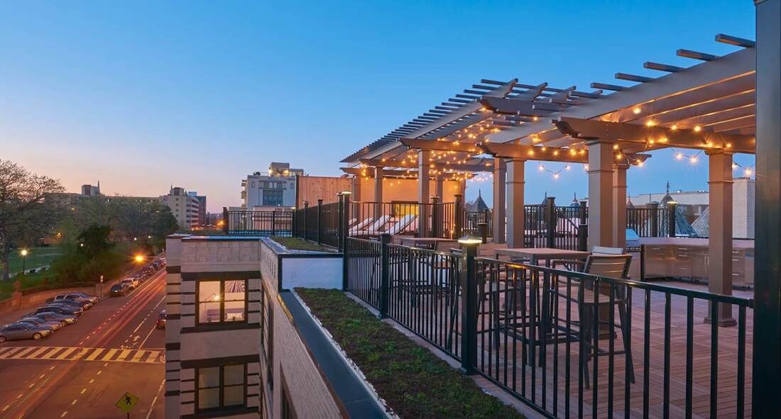 Rooftop patio with metal fence around it